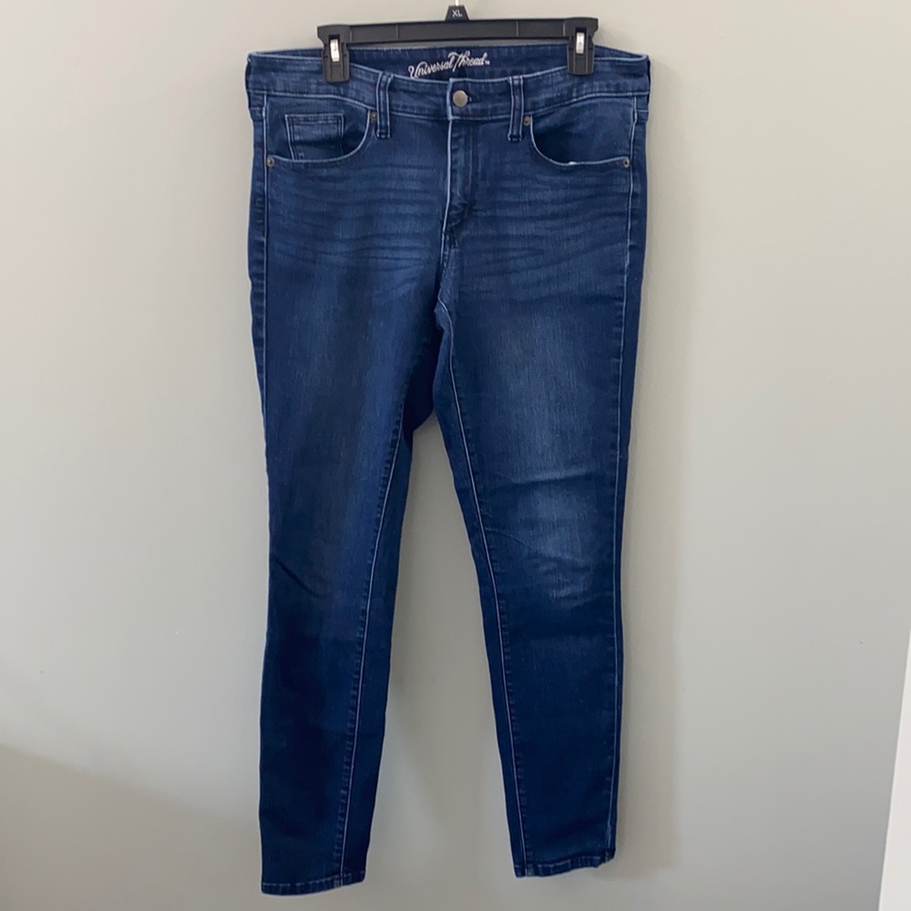 Universal Threads dark wash skinny jeans.
